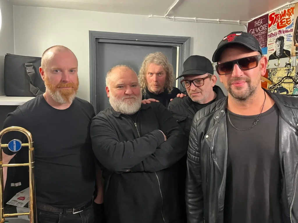 The band Dodgy posing for a photo.