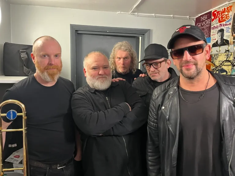 The band Dodgy posing for a photo.