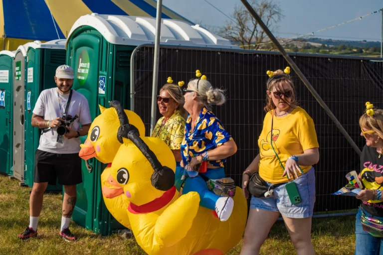 Two gatherers wearing inflatable duck costumes.
